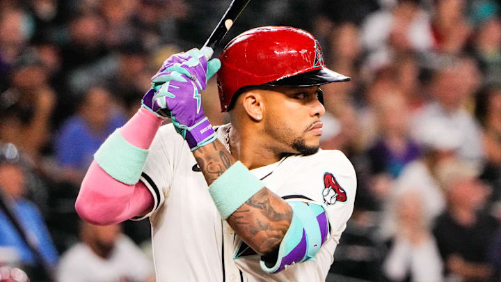 Sep 1, 2025; Phoenix, Arizona, USA;  Arizona Diamondbacks second base Ketel Marte (4) at bat in the first inning during the game between the Texas Rangers and Arizona Diamondbacks at Chase Field. Mandatory Credit: Arianna Grainey-Imagn Images