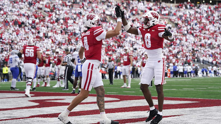 Sep 6, 2025; Madison, Wisconsin, USA; Wisconsin Badgers wide receiver Vinny Anthony II (8) high-fives Wisconsin Badgers wide receiver Jayden Ballard (4) after scoring a touchdown against the Middle Tennessee Blue Raiders during the second half at Camp Randall Stadium. Mandatory Credit: Kayla Wolf-Imagn Images Sep 6, 2025; Madison, Wisconsin, USA; Wisconsin Badgers wide receiver Vinny Anthony II (8) high-fives Wisconsin Badgers wide receiver Jayden Ballard (4) after scoring a touchdown against the Middle Tennessee Blue Raiders during the second half at Camp Randall Stadium. Mandatory Credit: Kayla Wolf-Imagn Images