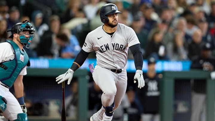 May 14, 2025; Seattle, Washington, USA; New York Yankees left fielder Jasson Dominguez (24) hits an RBI doube against the Seattle Mariners during the sixth inning at T-Mobile Park. Mandatory Credit: John Froschauer-Imagn Images