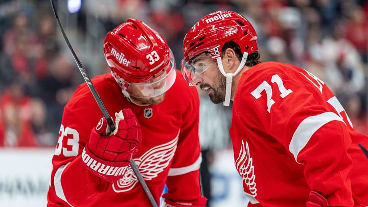Oct 9, 2026; Detroit, Michigan, USA; Detroit Red Wings center Dylan Larkin (71) and left wing Viktor Arvidsson (33) confer during a stoppage in play in the second period against the Seattle Kraken at Little Caesars Arena. Mandatory Credit: Paul Barnick-Imagn Images