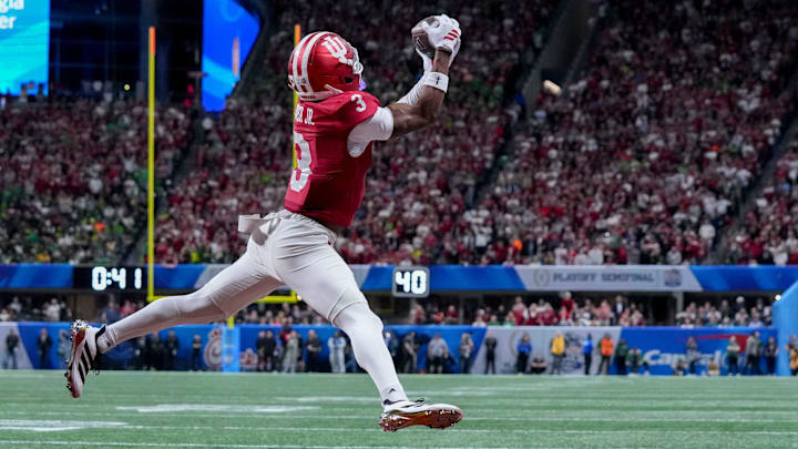Indiana Hoosiers wide receiver Omar Cooper Jr. (3) makes a catch for a touchdown Friday, Jan. 9, 2026, during the Peach Bowl and semifinal game of the College Football Playoff against the Oregon Ducks at Mercedes-Benz Stadium in Atlanta. Indiana Hoosiers wide receiver Omar Cooper Jr. (3) makes a catch for a touchdown Friday, Jan. 9, 2026, during the Peach Bowl and semifinal game of the College Football Playoff against the Oregon Ducks at Mercedes-Benz Stadium in Atlanta.