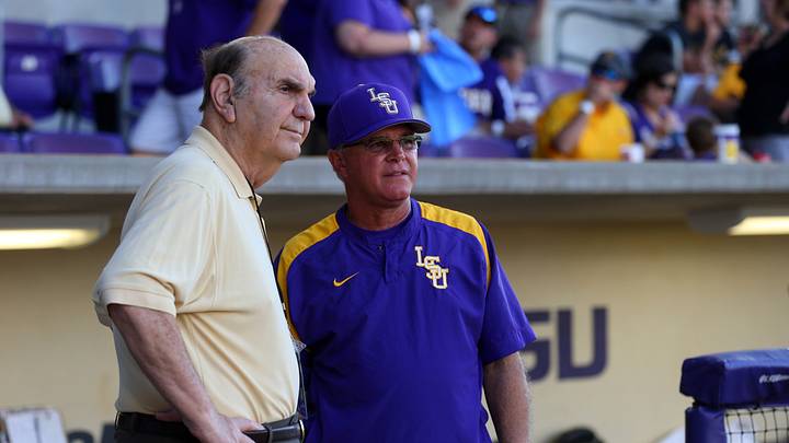 Skip Bertman stands with Paul Mainieri before a game in 2013