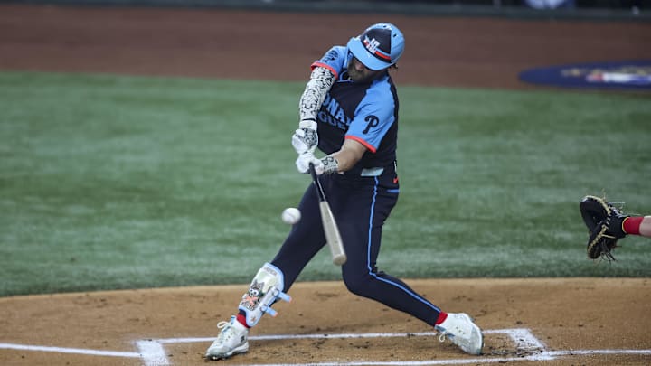 Jul 16, 2024; Arlington, Texas, USA; National League first baseman Bryce Harper of the Philadelphia Phillies (3) hits the ball during the first inning during the 2024 MLB All-Star game at Globe Life Field. 