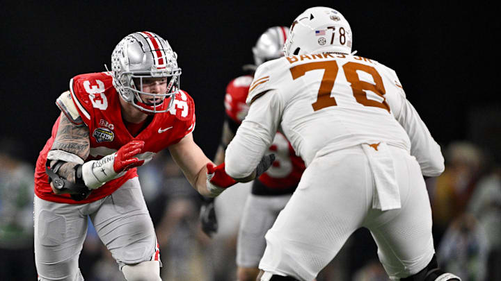 Jan 10, 2025; Arlington, TX, USA; Ohio State Buckeyes defensive end Jack Sawyer (33) rushes against Texas Longhorns offensive lineman Kelvin Banks Jr. (78) during the game at AT&T Stadium. Mandatory Credit: Jerome Miron-Imagn Images