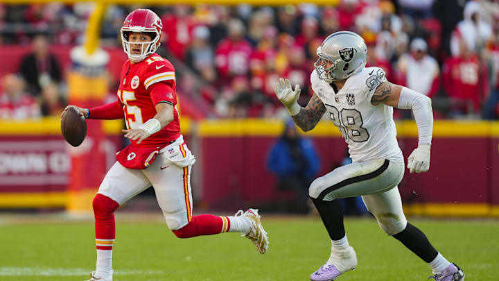 Nov 29, 2024; Kansas City, Missouri, USA; Kansas City Chiefs quarterback Patrick Mahomes (15) scrambles from Las Vegas Raiders defensive end Maxx Crosby (98) during the first half at GEHA Field at Arrowhead Stadium. Mandatory Credit: Jay Biggerstaff-Imagn Images Nov 29, 2024; Kansas City, Missouri, USA; Kansas City Chiefs quarterback Patrick Mahomes (15) scrambles from Las Vegas Raiders defensive end Maxx Crosby (98) during the first half at GEHA Field at Arrowhead Stadium. Mandatory Credit: Jay Biggerstaff-Imagn Images