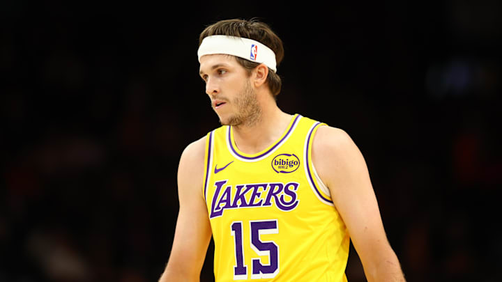 Oct 14, 2025; Phoenix, Arizona, USA; Los Angeles Lakers guard Austin Reaves (15) against the Phoenix Suns during an NBA preseason game at Mortgage Matchup Center. Mandatory Credit: Mark J. Rebilas-Imagn Images

