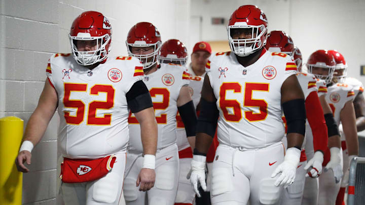 Dec 25, 2024; Pittsburgh, Pennsylvania, USA;  Kansas City Chiefs center Creed Humphrey (52) and guard Trey Smith (65) walk to the field to warm up against the Pittsburgh Steelers at Acrisure Stadium. Mandatory Credit: Charles LeClaire-Imagn Images