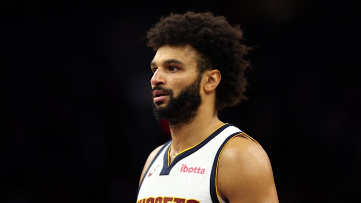 Nov 29, 2025; Phoenix, Arizona, USA; Denver Nuggets guard Jamal Murray (27) against the Phoenix Suns at the Mortgage Matchup Center.