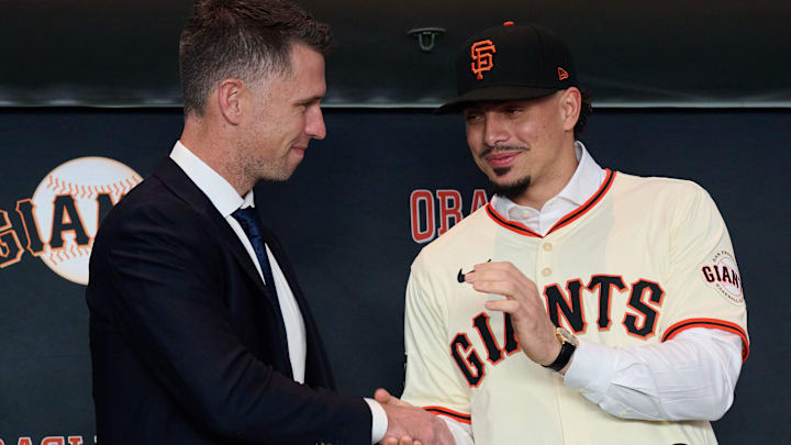 Dec 12, 2024; San Francisco, CA, USA; San Francisco Giants shortstop Willy Adames shakes hands with president of baseball operations Buster Posey during his introductory press conference at Oracle Park. Dec 12, 2024; San Francisco, CA, USA; San Francisco Giants shortstop Willy Adames shakes hands with president of baseball operations Buster Posey during his introductory press conference at Oracle Park.