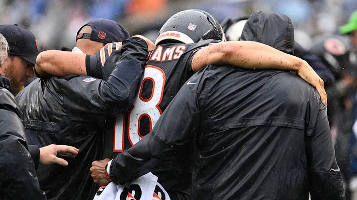 Sep 20, 2026; Chicago, Illinois, USA;  Chicago Bears quarterback Caleb Williams (18) is helped off the field with an apparent injury against the Minnesota Vikings during the second half at Soldier Field.  Mandatory Credit: Matt Marton-Imagn Images