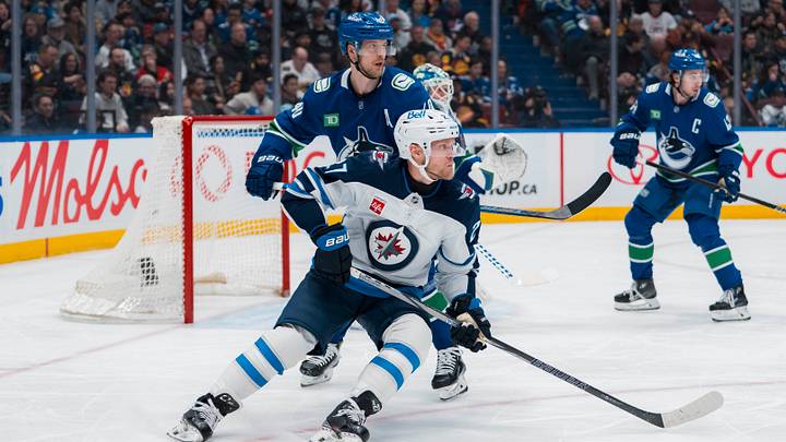 Mar 18, 2025; Vancouver, British Columbia, CAN; Vancouver Canucks forward Elias Pettersson (40) battles with Winnipeg Jets forward Nikolaj Ehlers (27) in the first period at Rogers Arena. Mandatory Credit: Bob Frid-Imagn Images Mar 18, 2025; Vancouver, British Columbia, CAN; Vancouver Canucks forward Elias Pettersson (40) battles with Winnipeg Jets forward Nikolaj Ehlers (27) in the first period at Rogers Arena. Mandatory Credit: Bob Frid-Imagn Images