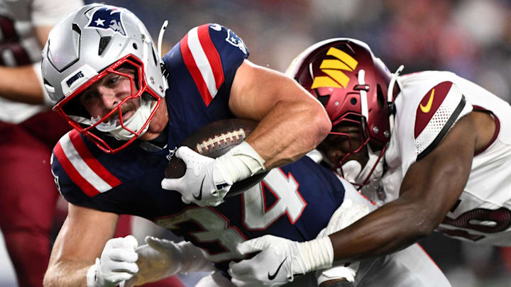 Aug 8, 2025; Foxborough, Massachusetts, USA; New England Patriots running back Lan Larison (34) rushes against the Washington Commanders during the second half at Gillette Stadium. Mandatory Credit: Brian Fluharty-Imagn Images