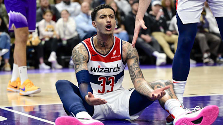 Washington Wizards forward Kyle Kuzma reacts on the ground to a call against the Utah Jazz during the second half at the Delta Center on March 4, 2024.