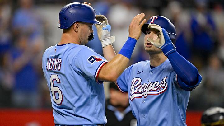 Texas Rangers second baseman Justin Foscue and third baseman Josh Jung (6) celebrate.