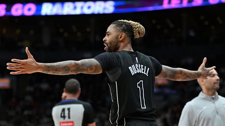 Jan 1, 2025; Toronto, Ontario, CAN;  Brooklyn Nets guard D'Angelo Russell (1) reacts after being called for a foul against the Toronto Raptors in the second half at Scotiabank Arena. Mandatory Credit: Dan Hamilton-Imagn Images