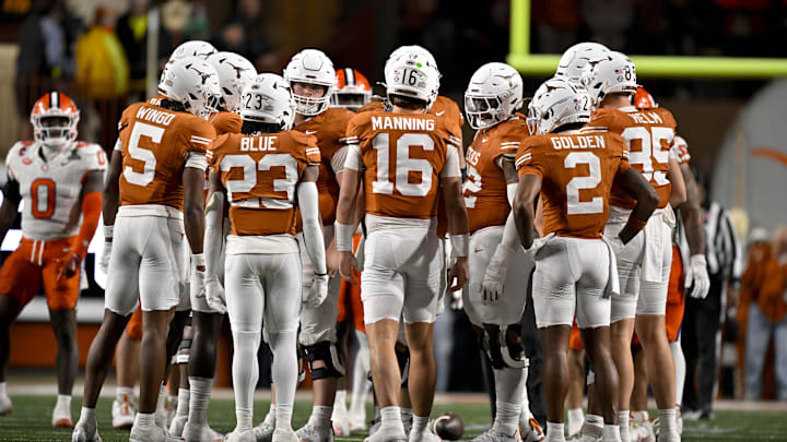 Texas Longhorns wide receiver Ryan Wingo (5) and running back Jaydon Blue (23) and quarterback Arch Manning (16) and wide receiver Matthew Golden (2) huddle