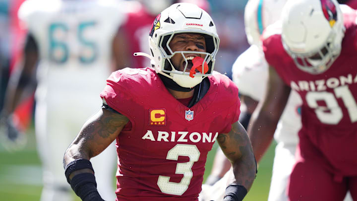 Oct 27, 2024; Miami Gardens, Florida, USA; Arizona Cardinals safety Budda Baker (3) celebrates tackling Miami Dolphins wide receiver Jaylen Waddle (17) for a short gain in the thirdquarter at Hard Rock Stadium. Mandatory Credit: Jim Rassol-Imagn Images Oct 27, 2024; Miami Gardens, Florida, USA; Arizona Cardinals safety Budda Baker (3) celebrates tackling Miami Dolphins wide receiver Jaylen Waddle (17) for a short gain in the thirdquarter at Hard Rock Stadium. Mandatory Credit: Jim Rassol-Imagn Images