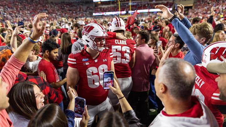 Oct 24, 2026; Madison, Wisconsin, USA;  Wisconsin Badgers students and fans rush the field at Camp Randall Stadium after the Badgers victory over the USC Trojans.  Mandatory Credit: Anthony Wahl-Imagn Images