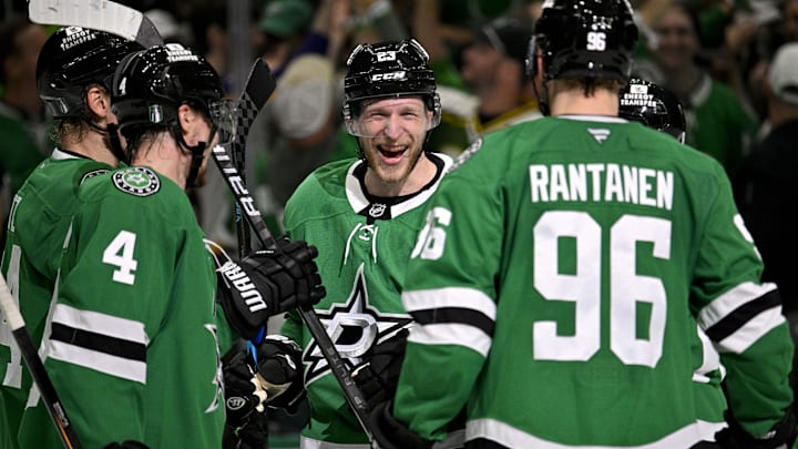 May 21, 2025; Dallas, Texas, USA; Dallas Stars defenseman Miro Heiskanen (4) and defenseman Esa Lindell (23) and right wing Mikko Rantanen (96) celebrate the empty net goal scored by Lindell against the Edmonton Oilers during the third period in game one of the Western Conference Final of the 2025 Stanley Cup Playoffs at American Airlines Center. Mandatory Credit: Jerome Miron-Imagn Images