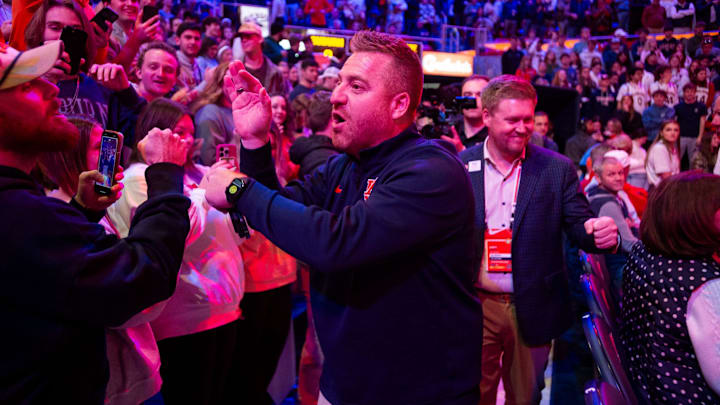 Newly hired Auburn football head coach Alex Golesh greets fans before Auburn Tigers take on NC State Wolfpack at Neville Arena in Auburn, Ala. on Wednesday, Dec. 3, 2025.