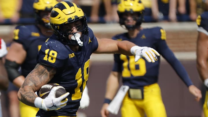 Sep 14, 2024; Ann Arbor, Michigan, USA;  Michigan Wolverines tight end Colston Loveland (18) runs the ball first half against the Arkansas State Red Wolves at Michigan Stadium. Mandatory Credit: Rick Osentoski-Imagn Images