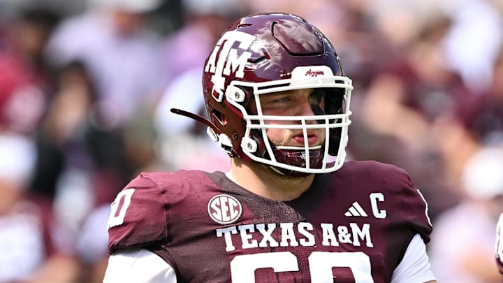 Oct 5, 2024; College Station, Texas, USA; Texas A&M Aggies offensive lineman Trey Zuhn III (60) walks on the field in the first half against the Missouri Tigers at Kyle Field. Mandatory Credit: Maria Lysaker-Imagn Images. 