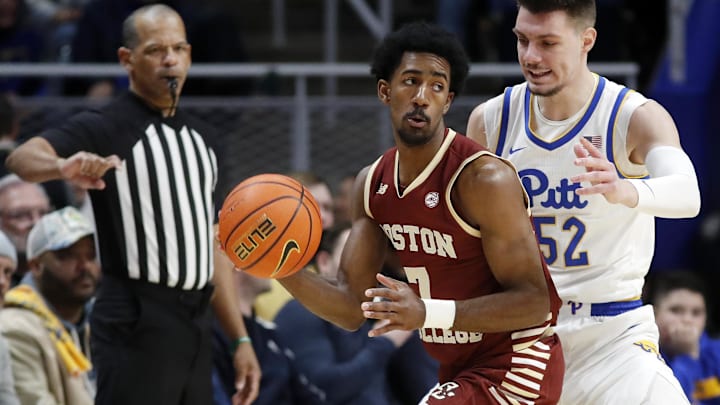Mar 8, 2025; Pittsburgh, Pennsylvania, USA;  Boston College Eagles guard Joshua Beadle (7) handles the ball as Pittsburgh Panthers guard Amsal Delalic (52) defends during the first half at the Petersen Events Center. Mandatory Credit: Charles LeClaire-Imagn Images