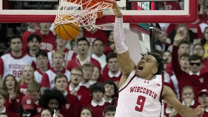 Wisconsin guard John Tonje (9) throws down a dunk during the first half of their game against Michigan Tuesday, December 3, 2024 at the Kohl Center in Madison, Wisconsin. Wisconsin guard John Tonje (9) throws down a dunk during the first half of their game against Michigan Tuesday, December 3, 2024 at the Kohl Center in Madison, Wisconsin.