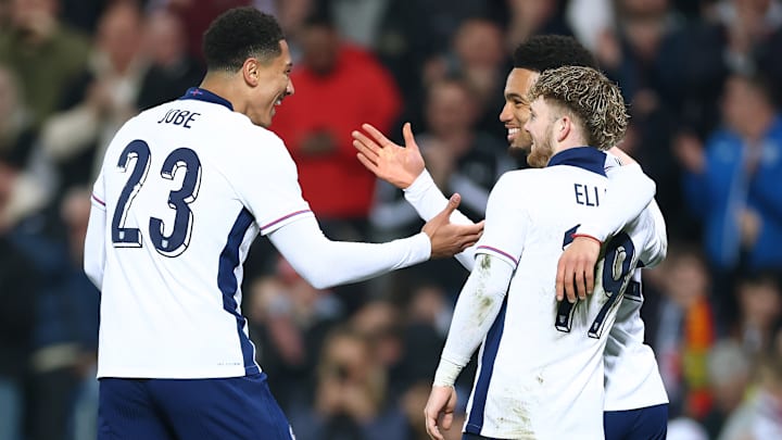 Ethan Nwaneri (right) celebrates his England goal with Jobe Bellingham and Harvey Elliott