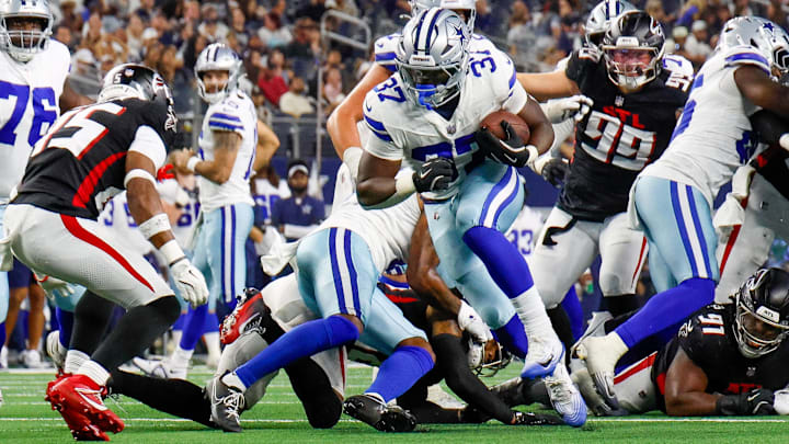Dallas Cowboys running back Phil Mafah breaks through the line during the fourth quarter against the Atlanta Falcons. Dallas Cowboys running back Phil Mafah breaks through the line during the fourth quarter against the Atlanta Falcons.
