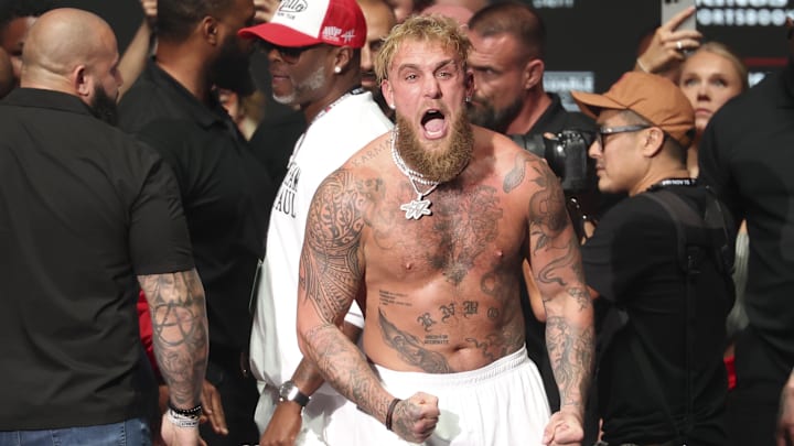 Nov 14, 2024; Irving, TX, USA;  Jake Paul reacts after being slapped by Mike Tyson (not pictured) after the weigh-in at the Toyota Music Factory. 