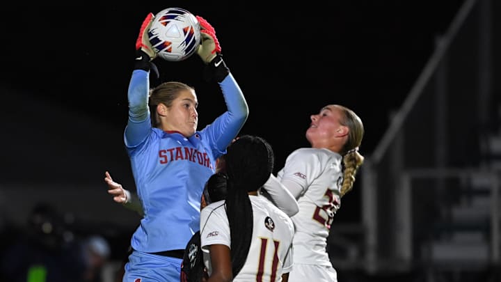 Ryan Campbell (1) makes a save as Florida St. forward Jordynn Dudley (11) and defender Heather Gilchrist (20)  