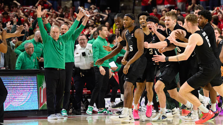 Feb 26, 2025; College Park, Maryland, USA; Michigan State Spartans celebrate after a shot by Michigan State Spartans guard Tre Holloman (5) goes in at the buzzer against the Maryland Terrapins during the second half at Xfinity Center. Mandatory Credit: Reggie Hildred-Imagn Images