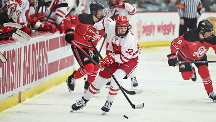 Wisconsin defender Laney Potter (22) picks up the puck to lead a rush against Ohio State in a game Sunday, February 8, 2026, at LaBahn Arena in Madison, Wisconsin. The Badgers won, 4-1.