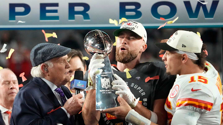 Super Bowl 57: Kansas City Chiefs quarterback Patrick Mahomes passes the the Lombardi Trophy to Travis Kelce after winning the Super Bowl against the Philadelphia Eagles at State Farm Stadium on Feb 12, 2023.