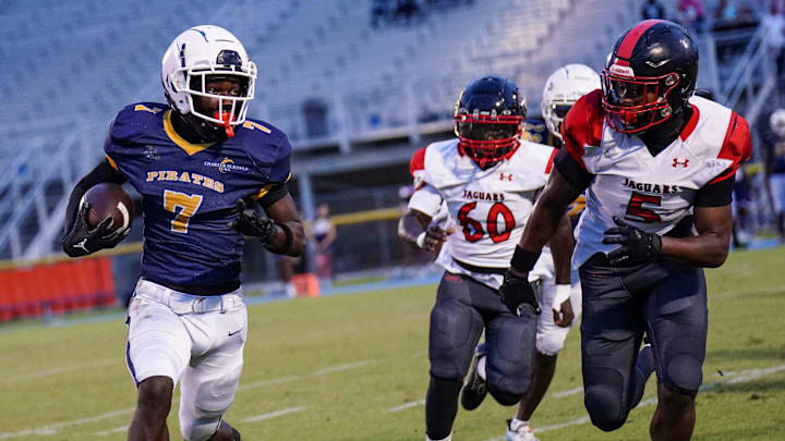 Tradition Prep's Jah'Zion Drummond tries to outrun Port St. Lucie's Terriel Harmon, Jr. during a high school football game on Thursday, October 3, 2024 at South County Stadium in Port St. Lucie. Tradition Prep's Jah'Zion Drummond tries to outrun Port St. Lucie's Terriel Harmon, Jr. during a high school football game on Thursday, October 3, 2024 at South County Stadium in Port St. Lucie.
