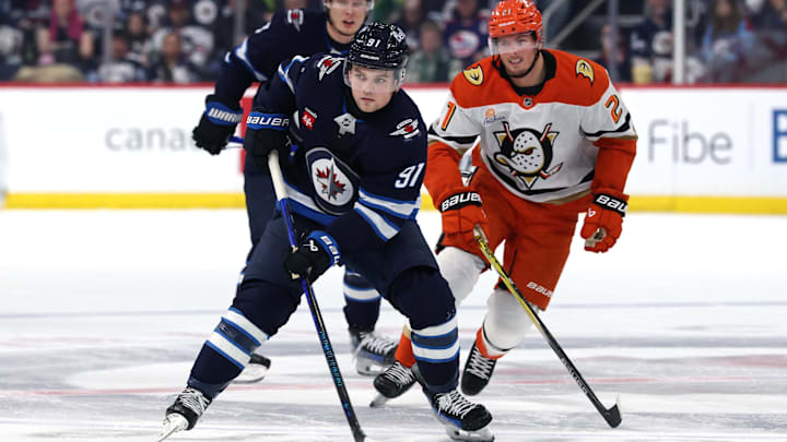 Jan 2, 2025; Winnipeg, Manitoba, CAN; Winnipeg Jets center Cole Perfetti (91) is chased down by Anaheim Ducks center Isac Lundestrom (21) the second period at Canada Life Centre. Mandatory Credit: James Carey Lauder-Imagn Images Jan 2, 2025; Winnipeg, Manitoba, CAN; Winnipeg Jets center Cole Perfetti (91) is chased down by Anaheim Ducks center Isac Lundestrom (21) the second period at Canada Life Centre. Mandatory Credit: James Carey Lauder-Imagn Images