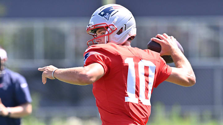Jul 28, 2025; Foxborough, MA, USA; New England Patriots quarterback Drake Maye (10) throws a pass during training camp at Gillette Stadium. Mandatory Credit: Eric Canha-Imagn Images