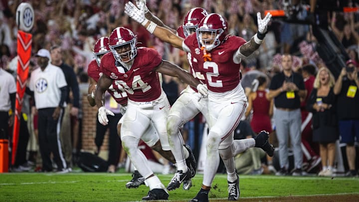 Sep 28, 2024; Tuscaloosa, Alabama, USA; Alabama Crimson Tide defensive back Zabien Brown (2) and linebacker Que Robinson (34) celebrate after an interception against the Georgia Bulldogs in the fourth quarter at Bryant-Denny Stadium. Mandatory Credit: Will McLelland-Imagn Images