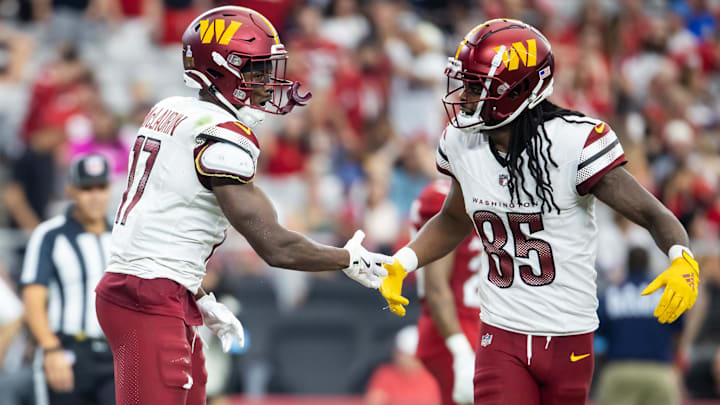 Washington Commanders wide receiver Terry McLaurin (17) celebrates a touchdown with Noah Brown (85)