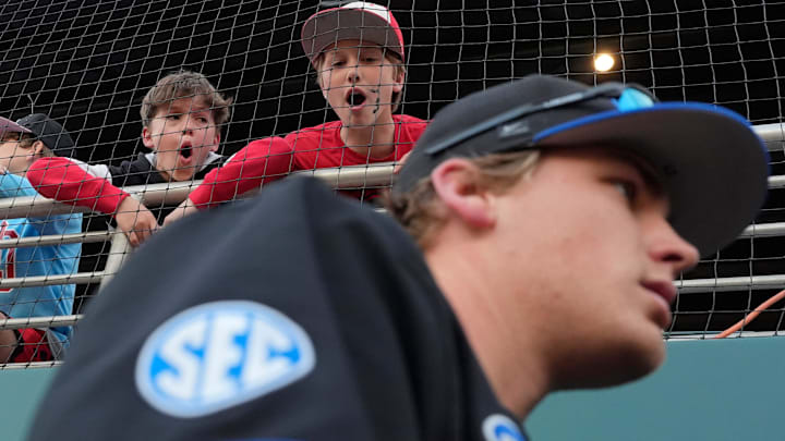 Some young Georgia fans bark at Kentucky players as they enter the dugout during a NCAA baseball game against Kentucky on March 14, 2025.