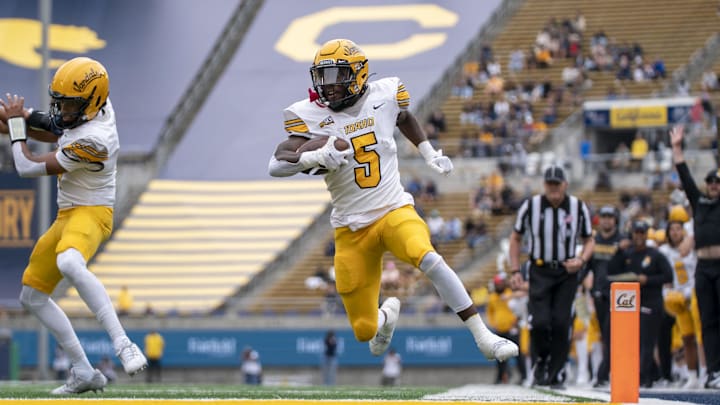 September 16, 2023; Berkeley, California, USA; Idaho Vandals running back Anthony Woods (5) scores a touchdown against the California Golden Bears during the first quarter at California Memorial Stadium. Mandatory Credit: Kyle Terada-Imagn Images