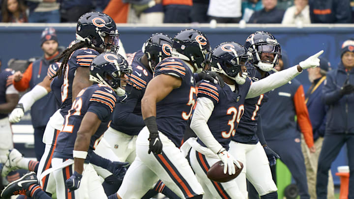  Chicago Bears teammates celebrate a turnover.