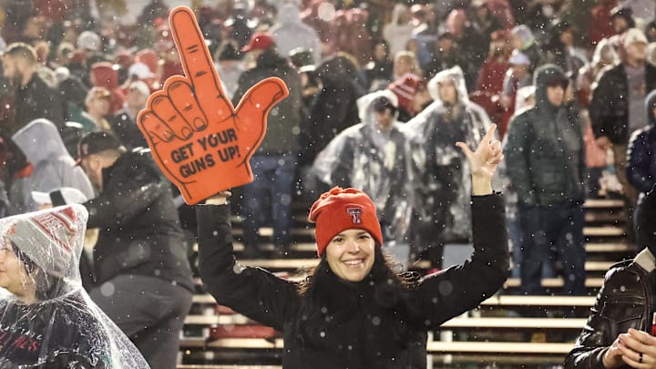 Nov 2, 2024; Ames, Iowa, USA;  Texas Tech Red Raiders fans celebrate after beating the Iowa State Cyclones at Jack Trice Stadium. The Red Raiders won 23-22.  Mandatory Credit: Reese Strickland-Imagn Images