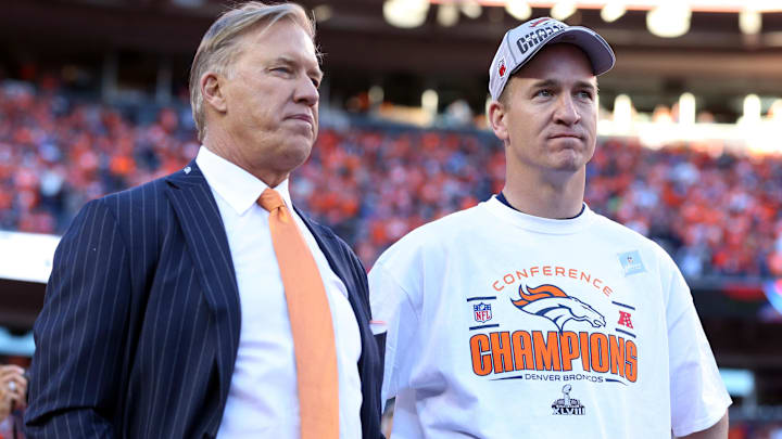 Jan 19, 2014; Denver, CO, USA; Denver Broncos executive vice president of football operations John Elway and quarterback Peyton Manning (18) after the 2013 AFC championship playoff football game against the New England Patriots at Sports Authority Field at Mile High. Mandatory Credit: Matthew Emmons-Imagn Images