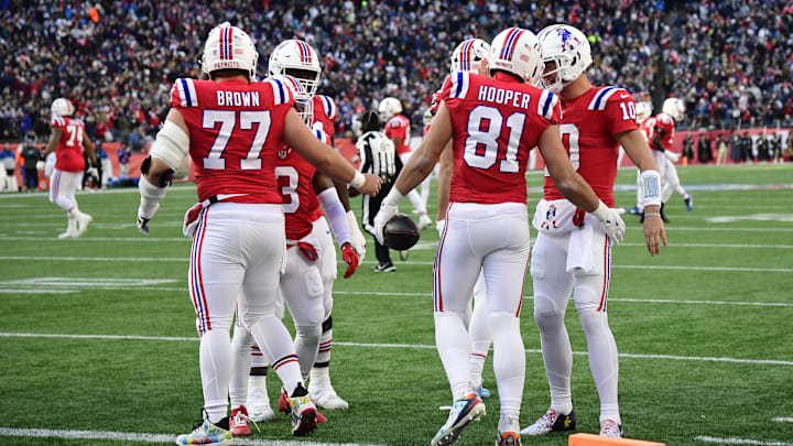 Dec 1, 2024; Foxborough, Massachusetts, USA;  New England Patriots tight end Austin Hooper (81) is congratulated by quarterback Drake Maye (10) after catching a touchdown pass during the first half against the Indianapolis Colts at Gillette Stadium.