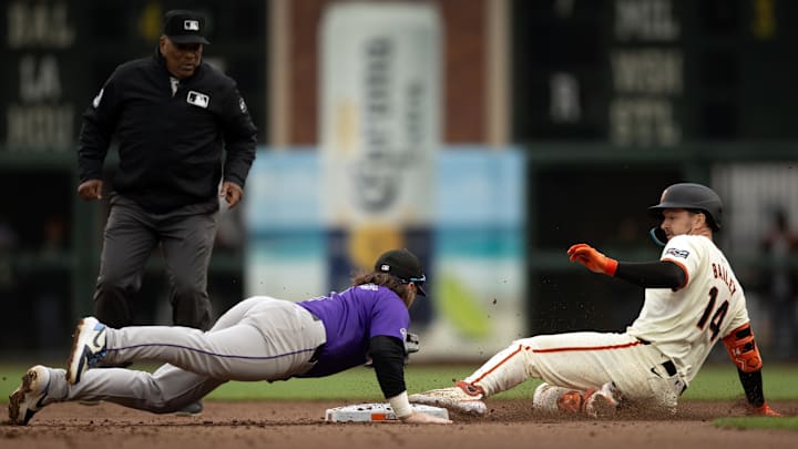 Jul 27, 2024; San Francisco, California, USA; San Francisco Giants catcher Patrick Bailey (14) slides safely into second base with a double ahead of a diving tag attempt by Colorado Rockies second baseman Brendan Rodgers (7) during the seventh inning at Oracle Park. Umpire is Laz Diaz. Jul 27, 2024; San Francisco, California, USA; San Francisco Giants catcher Patrick Bailey (14) slides safely into second base with a double ahead of a diving tag attempt by Colorado Rockies second baseman Brendan Rodgers (7) during the seventh inning at Oracle Park. Umpire is Laz Diaz.