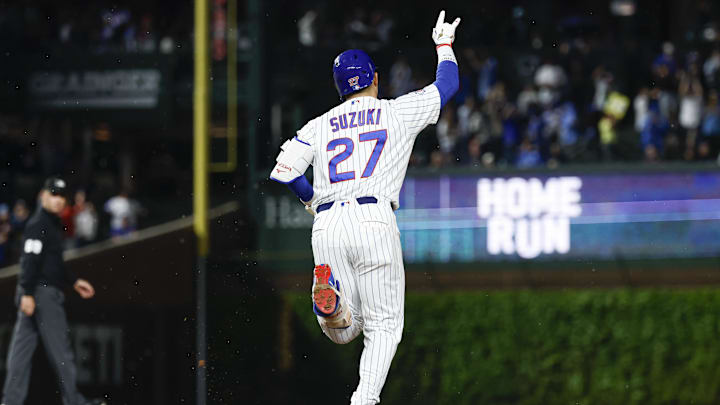May 4, 2026; Chicago, Illinois, USA; Chicago Cubs right fielder Seiya Suzuki (27) reacts as he rounds the bases after hitting a three-run home run against the Cincinnati Reds during the fourth inning at Wrigley Field. Mandatory Credit: Kamil Krzaczynski-Imagn Images