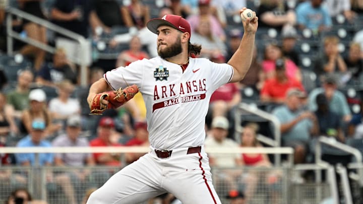 Jun 17, 2025; Omaha, Neb, USA; Arkansas Razorbacks starting pitcher Zach Root (33) throws against the UCLA Bruins during the first inning at Charles Schwab Field. Mandatory Credit: Steven Branscombe-Imagn Images Jun 17, 2025; Omaha, Neb, USA; Arkansas Razorbacks starting pitcher Zach Root (33) throws against the UCLA Bruins during the first inning at Charles Schwab Field. Mandatory Credit: Steven Branscombe-Imagn Images