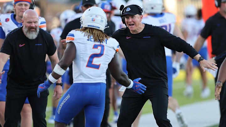 Boise State Broncos head coach Spencer Danielson reacts with running back Ashton Jeanty.